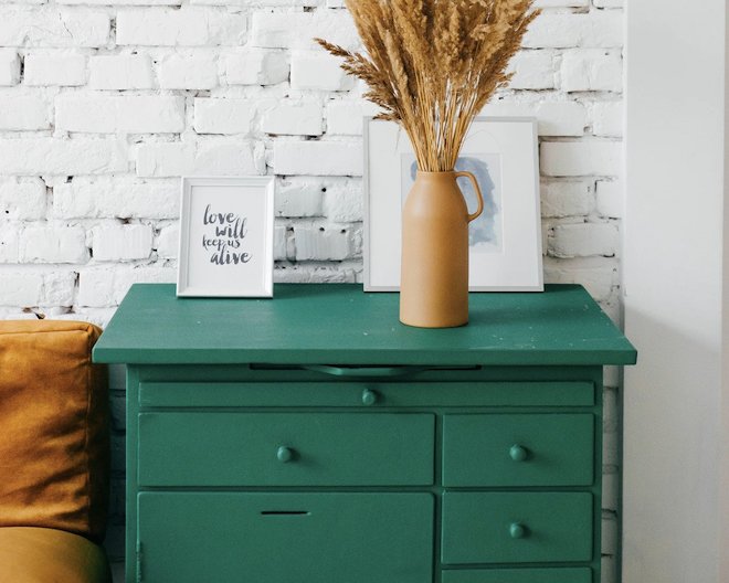 Picture of drawers with a plant on top